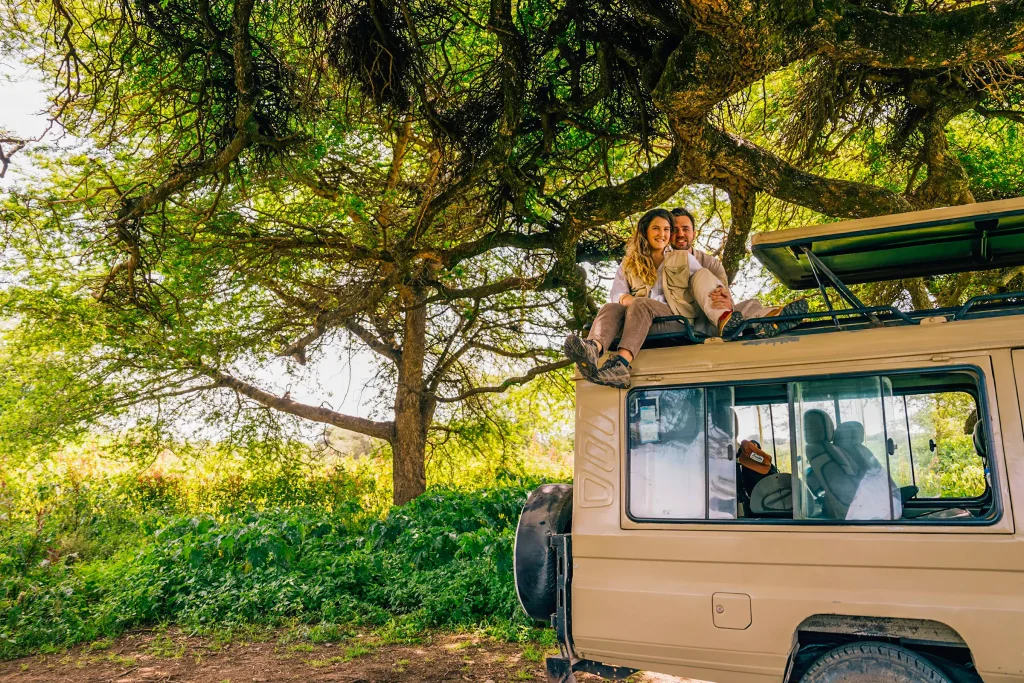 A magnificent African sunrise over the Serengeti horizon with acacia trees in silhouette.-Best Tanzania Safari Tour Packages-Honeymoon Tours-3-Day Northern Tanzania Safari Overview Safari